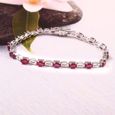 Natural Ruby Gemstone Bracelet, 925 Sterling Silver Bracelet, Pretty Bracelet, Handmade Jewelry, July Birthstone, Gift For Wife, Ruby Jewelry | Vibrant And Unique Gemstone Give This Jewelry Bracelet An Eye Catching Allure | This Bracelet Will Provide A Perfect Sense Of Elegance To Your Beauty | Metal     925 Sterling Silver Stone     Ruby  Stone Shape    Oval Stone Size    4X6 MM Birthstone    July Product Length  07.5 inch Total Item Weight    12.05Grams Note  :-   1)  If You Want Any Stone Size And Other Stone So Massage Me Here.   We Also Provide Different Size & Different Type Of Stone In Our Jewelry When You Start Wearing A Piece Of My Jewelry You Will Fall In Love With It More And More Each Day  And Feel That Good Energy And Love That I Pass Into It While Creating This Piece Of Art Sterling Silver Bracelet With Gemstone, Sterling Silver White Gold Bracelets With Gemstone, Sterling Silver Fine Jewelry Bracelets With Stones, Hallmarked Sterling Silver Tennis Bracelet, Sterling Silver Gemstone Tennis Bracelet, Elegant Natural Ruby Gemstones, Sterling Silver Bracelet With Stones For Formal Occasions, Elegant Bracelets With Natural Stones, Silver Ruby Gemstone Bracelets