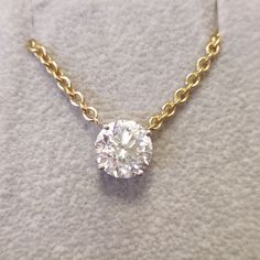 Keep your 2 carats Round diamond close to your heart with this mesmerizing 14K / 18K Yellow gold pendant & necklace. With a 2 carats as its main diamond, this design is guaranteed to draw attention in every scenery. Jewelry Details Main Diamond Accent Diamonds Total Carat Weight: 2 cts Gold KT: 14K / 18K Gold Color: Yellow Size: Resizable Certificate: GIL Shape: Round Weight: 2 cts Color: F Clarity: SI1 Natural Earth-Mined Diamond Shape: Weight: 0 cts Color: E-F Clarity: VS-SI Natural Earth- Luxury Everyday Solitaire Necklace With Round Pendant, Oval Diamond Solitaire Necklace With Brilliant Cut, Diamond Solitaire Necklace Brilliant Cut Oval Pendant, Luxury Solitaire Necklace With Brilliant Cut Pendant, Timeless Diamond Pendant Necklace With Vvs Clarity, Diamond Solitaire Necklace With Brilliant Cut Oval Pendant, Timeless Diamond Pendant Necklace With Prong Setting, Luxury Single Diamond Round Pendant Necklace, Formal Single Diamond Pendant Necklace