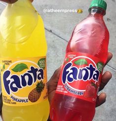 two bottles of fanta pineapple and strawberry juice