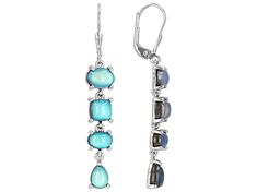 Introducing our mesmerizing Blue Aurora Moonstone Rhodium Over Sterling Silver Dangle Earrings! These earrings are like a dance party for your ears, with their stunning moonstone gems that shimmer and shine just like the full moon on a clear night. The elegant rhodium over sterling silver setting adds an extra touch of sophistication to these beauties. Perfect for adding a pop of color and fun to any outfit, these dangle earrings will have you feeling as radiant as the aurora borealis in no time Blue Moonstone Drop Earrings, Modern Moonstone Drop Earrings, Elegant Blue Moonstone Earrings, Silver Moonstone Earrings With Gemstone Accents, Resort Jewelry, Blue Aurora, Stud Earrings Unique, Mixed Metal Jewelry, Vintage Inspired Jewelry