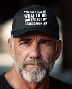 a man wearing a hat that says you can't tell me what to do, you are not my granddaughter