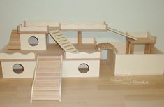 a cat house made out of wood and cardboard