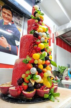 a fruit christmas tree made out of fruits