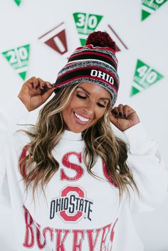 We love this game day focused beanie! The pom-pom detail met with the knit detail creates the ideal piece for game days! Fabric: Shell: 100% Acrylic, Lining: 90% Polyester, 10% Wool One size Packaged with love and shipped from our warehouse in Wilmington, Ohio Casual Fall Beanie With Pom Poms, Style Wide Leg Jeans, Bride Top, Festival Shop, Oversized Crewneck, Exclusive Dress, Vintage Havana, Curvy Dress, Dresses By Length