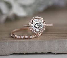 a close up of a diamond ring on top of a table