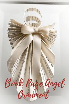 a book page angel ornament with ribbon