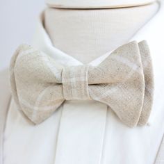 "Dapper Men's Natural Linen Windowpane Bow Tie Made By The Belle And The Beau! ♥ Beautiful linen/cotton blend yarn dyed woven fabric! Our dapper, modern, stylish, and charming neckties are perfect for everyday, Sunday best, all special occasions, photography sessions, and especially dapper on grooms and groomsmen! They are the perfect wedding accessory. We use the best cotton and cotton blend fabrics. We love that cotton is so versatile to dress up or down for any occasion. Each bow tie has a do White Standard Bow Tie, White Dapper Ties For Black Tie Events, Dapper White Ties For Black Tie Events, Dapper White Tie For Black Tie Events, Dapper White Adjustable Suit And Tie Accessories, Dapper White Suit And Tie Accessories For Summer, Dapper White Suit And Standard Tie Accessories, White Adjustable Bow Tie Suit Accessories, White Bow Tie For Wedding