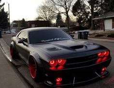 a black sports car parked on the street