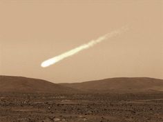 an object is flying in the sky over some hills and deserts with mountains behind it