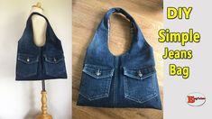 a handbag made out of old jeans is hanging on the wall and next to it's wooden mannequin