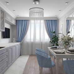 a dining room and kitchen with blue chairs