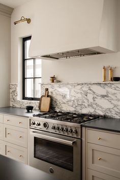 a stove top oven sitting inside of a kitchen