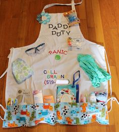 a child's apron with personal items laid out on it