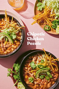 two bowls filled with food sitting on top of a table