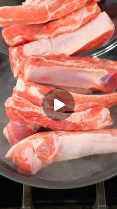 raw meat being cooked in a frying pan