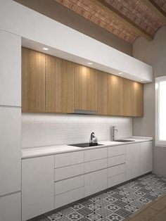 a white kitchen with wooden cabinets and tile flooring