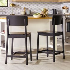 Sit down, relax, and stay for a while! This set of counter stools is here to make your home more comfortable and inviting, no matter who comes over to visit. The simple, modern style is ideal for a variety of home designs, including transitional and mid-century. The solid wood base ensures durability, and adjustable foot levelers make it easy to stabilize the chairs on any surface. It doesn't matter if you live in a small apartment, spacious house, or loft. These stools will blend well with your White Cabinets With Black Island Hanging Bar Stools, Basement Bar Table & Bar Stools, Black Wooden Bar Stools, Black Kitchen Island Table & Bar Stools, Counter Height Bar Stools Swivel Black Metal, Counter Height Bar Stools, Counter Height, Small Apartments, How To Better Yourself