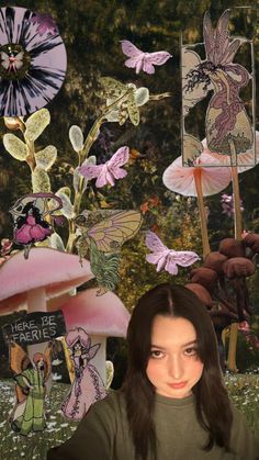 a woman standing in front of a collage of flowers and fairy figures with her hands on her hips