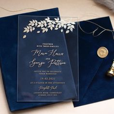 a blue wedding card with gold foil on it