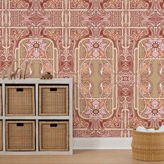 an ornate wallpaper design in pink and orange with wicker baskets on the floor