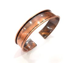 Nickel Free and Lead Free Material : Brass Color: Antique Copper Size : 15mm Blank size : 11,7 mm Quantity : 1 pc. To see other all Antique Copper Bracelet Blanks please click below https://www.etsy.com/shop/AZsupplies/search?search_query=bracelet+blank+Antique+copper&order=date_desc&view_type=list&ref=shop_search To see other all Antique Copper Ring Blanks please click below https://www.etsy.com/shop/AZsupplies/search?search_query=nice+ring+blank+antique+copper&order=date_desc&view_type=list&re Adjustable Round Copper Cuff Bracelet, Adjustable Copper Cuff Bracelet, Copper Bangle Gift, Bracelet Blanks, Ring Blanks, Bronze Bracelets, Gold Armband, Tarnished Silver, Copper Ring