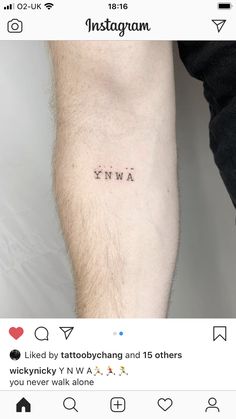 a person with a small tattoo on their arm