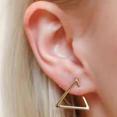 FUN AND SOPHISTICATED WHAT IT IS: Gold triangle shaped hoops WHY IT’S SPECIAL: Modern in shape and design, yet understated and classic in scale - they are a nice edgy update to your everyday hoop game Wear them day to night with ease GOOD TO KNOW: 14k gold vermeil WHY WE LOVE BING BANG NYC: Made in New York, Bing Bang NYC designs on-trend pieces with a little bit of edge. Their line is a minimalist’s dream with a big dose of whimsy thrown in. Triangle Gold Earrings, Diy Lip Scrub, Triangle Jewelry, Double Piercing, Diamond Cluster Earrings, Geode Earrings, Gold Jewelry Sets, Ruby Earrings, Triangle Earrings