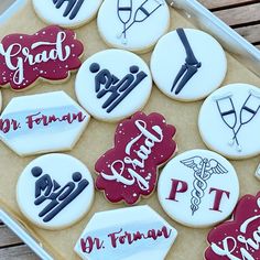 decorated cookies in the shape of doctors and nurse's names are on a tray