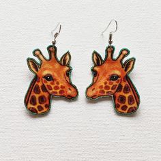 Handmade Giraffe Gold-Etched Fabric Earrings / Colourful Quirky Unique Fabric Dangle Earrings Made from 100 percent gold-etched cotton material Lightweight Waterproof Stiffened, not floppy Protective rubber earrings backs provided Length is 1 3/4 inches or 4.44 centimetres Fun-to-wear conversation piece Mood lifter - treat yourself  Perfect gift for someone you love or just like a lot Earrings easily slip into birthday and Christmas cards - no extra postage - and into earlobes One fabric-loving Adjustable Animal Design Earrings As Gift, Animal Design Dangle Earrings As Gift, Giraffe Earrings, Rubber Earrings, Giraffe Fabric, Giraffe Jewelry, Earrings Fabric, Fabric Earrings, Cute Fish