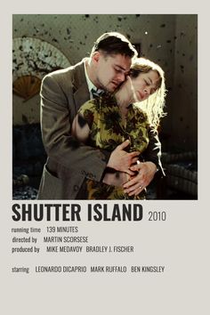 a man and woman hugging each other in front of a poster for the film shutter island 2010