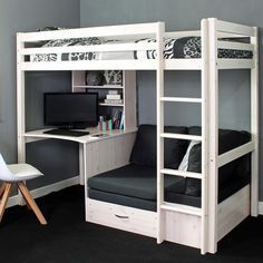 a white bunk bed sitting next to a desk