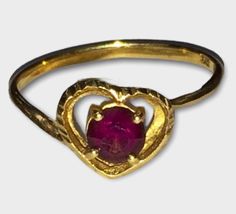 Vintage 10K Yellow Gold Garnet HEART Band Ring Size 6.5 Crafted of solid gold with a round garnet center stone Size 6.5 1.1 grams of solid 10k gold! Shipped insured in a gift box. I guarantee item to be exactly as described and pictured. Garnet Heart, Heart Band, 10k Gold, Band Ring, Band Rings, Heart Ring, Garnet, Solid Gold, Ring Size