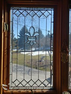 a stained glass window in the corner of a room