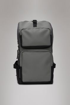 a gray and black backpack on a grey background