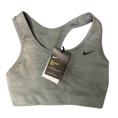 Nike Swoosh Women's Support Sports Bra - Grey Heather, Size Small Step Up Your Workout Game With This Classic Grey Heather Nike Swoosh Sports Bra, Designed To Give You Medium Support Throughout Your Fitness Routine. This Sports Bra, Available In Size Small, Is A Perfect Blend Of Comfort And Functionality. It's Crafted With Nike's Signature Dri-Fit Technology Fabric, Which Wicks Away Sweat To Keep You Dry And Comfortable During Intense Workouts. The Racerback Design Ensures A Snug Fit, While The Nike Athletic Fit Activewear For Sports Events, Nike Athletic Heather Activewear For Running, Nike Sportswear For Sports Events, Nike Fitted Activewear For Sports, Nike Fitted Sports Activewear, Athletic Heather Activewear With Medium Support For Sports, Nike Athleisure Activewear In Athletic Heather, Nike Athletic Heather Activewear For Gym, Nike Athletic Heather Activewear For Workout