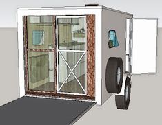 an image of a trailer with its door open and wheels on the floor next to it