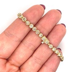 Estate Diamond Bracelet- 3CT Round Shape Natural Diamond, Solid 14k Yellow Gold , One Of A Kind Bracelet, Estate jewelry, Women Gold Bracelet, Vintage Bracelet One Of A Kind   ~~ S e t t i n g ~~ Solid 18k White Gold 16.00 grams     ~~ Stones ~~ Main Stone: Round Shape Natural Diamond In Weight Of 3 Ct (Approx.)  Clarity - Si1 Color  - K-L Feel free to contact us for inquiries and consultation and special requests. The item will be shipped in a luxury box and bag ready as a gift - The shipment p Gold Bracelet With Bezel Setting For Anniversary, Anniversary Gold Bracelet With Bezel Setting, Yellow Gold Bracelet With Bezel Setting For Anniversary, Yellow Gold Bracelets With Bezel Setting For Anniversary, 14k Gold Bracelet With Bezel Setting For Anniversary, Luxury Gold Tennis Bracelet With Bezel Setting, 14k Gold Bezel Setting Tennis Bracelet, 14k Gold Tennis Bracelet With Bezel Setting, Luxury Gold Bracelet With Bezel Setting