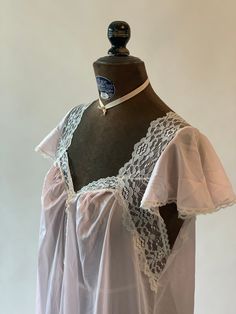 "Vintage 1990s pink and off white / cream lace trim nightgown. Gathered at bust. Tags read Sopre Lingerie, Medium. Measurements: Bust: 40\" Waist: 46\" Hips: 50\" Shoulder to hem: 54\"" White Lace Chemise For Bedtime, White Nightgown With Delicate Lace, White Lace Nightgown For Night, Feminine White Lace Nightgown, White Lace Nightgown With Lace Trim, White Lace Nightgown For Bedtime, Pink Lace Nightgown With Delicate Details, Coquette Nightgown With Lace Trim, Vintage Nightgown With Lace Trim For Bedtime