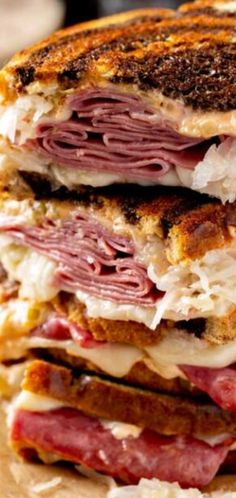 a grilled sandwich with meat and cheese