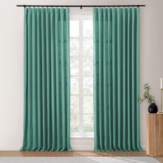 the curtains in this room are bright green