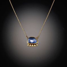 A luminous rose cut sapphire in accentuated with a sparkling diamond line. This piece exudes an organic yet luminous and elegant look. Perfect for a special occasion, or to elevate everyday. 22k gold bezel, backed in sterling silver with 14k gold chain. Matte finish. Pendant is approximately 1/3" x 1/2". Sapphire Jewelry Stone, Resetting Diamonds Necklace, Sapphire Jewelry Minimal, Luxury Gemstone Heirloom Necklace, Luxury Timeless Jewelry With Gemstone Accents, Luxury Modern Gemstone Necklaces, Luxury Sapphire Necklace With Bezel Setting, Sapphire Necklace Simple Stone, Bezel Set Floating Sapphire Necklace