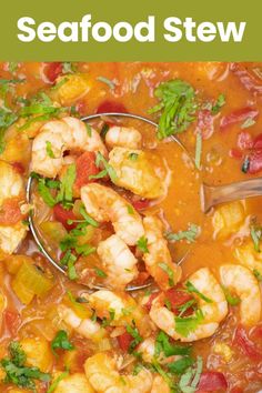 the seafood stew is ready to be eaten and served in a bowl with a spoon