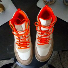 Nice Tan And Orange Winter Boots Beige High-top Sneakers With Contrast Sole And Round Toe, Orange Lace-up Sneakers For Fall, Orange Sneakers With Removable Insole And Round Toe, Orange Lace-up High-top Sneakers, Sporty Beige Lace-up Boots, Sporty Lace-up Beige Boots, Brown High-top Sneakers With Round Toe For Walking, Orange High-top Sneakers With Contrast Sole, Spring Orange High-top Sneakers With Round Toe