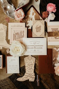 the wedding stationery is laid out and ready for guests