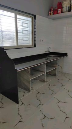 an empty bathroom with white walls and marble flooring