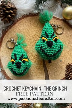 two crocheted keychains with green faces on them