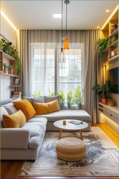 a living room filled with lots of furniture and plants on the wall above it's windows