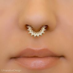 a close up view of a nose piercing