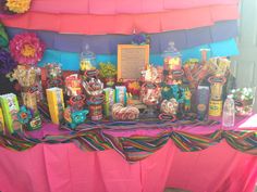 the table is covered with candy and candies