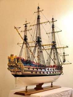 a model ship on display in a room